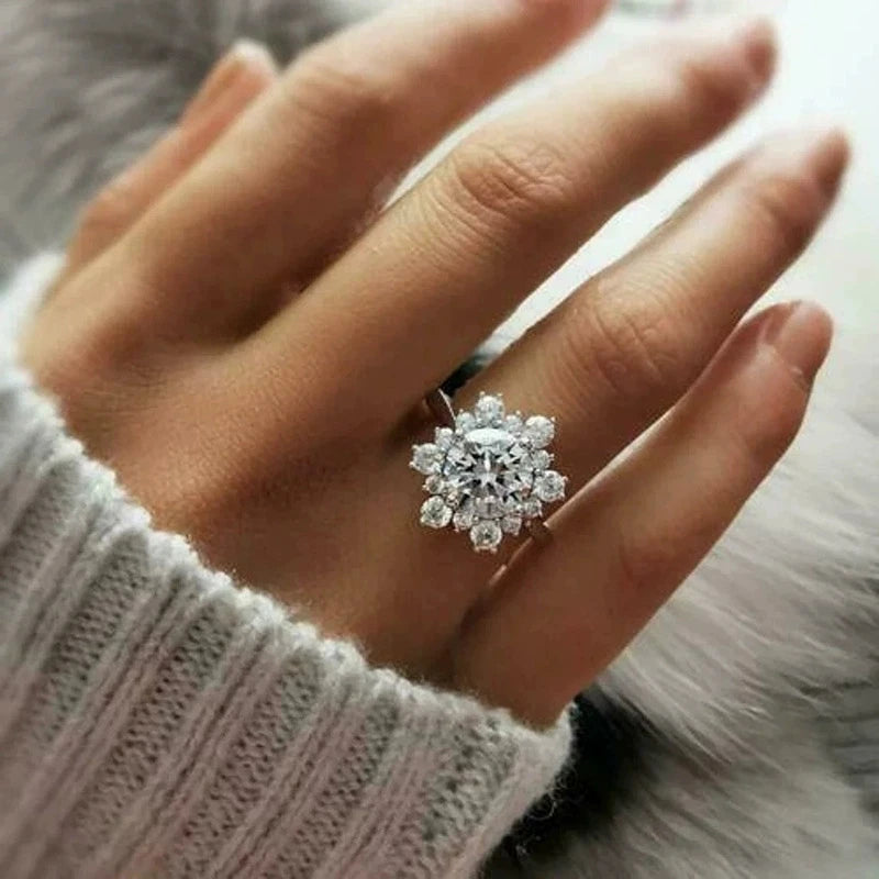 Close-up of a hand wearing a diamond like ring, with a soft focus effect | The Tottos 