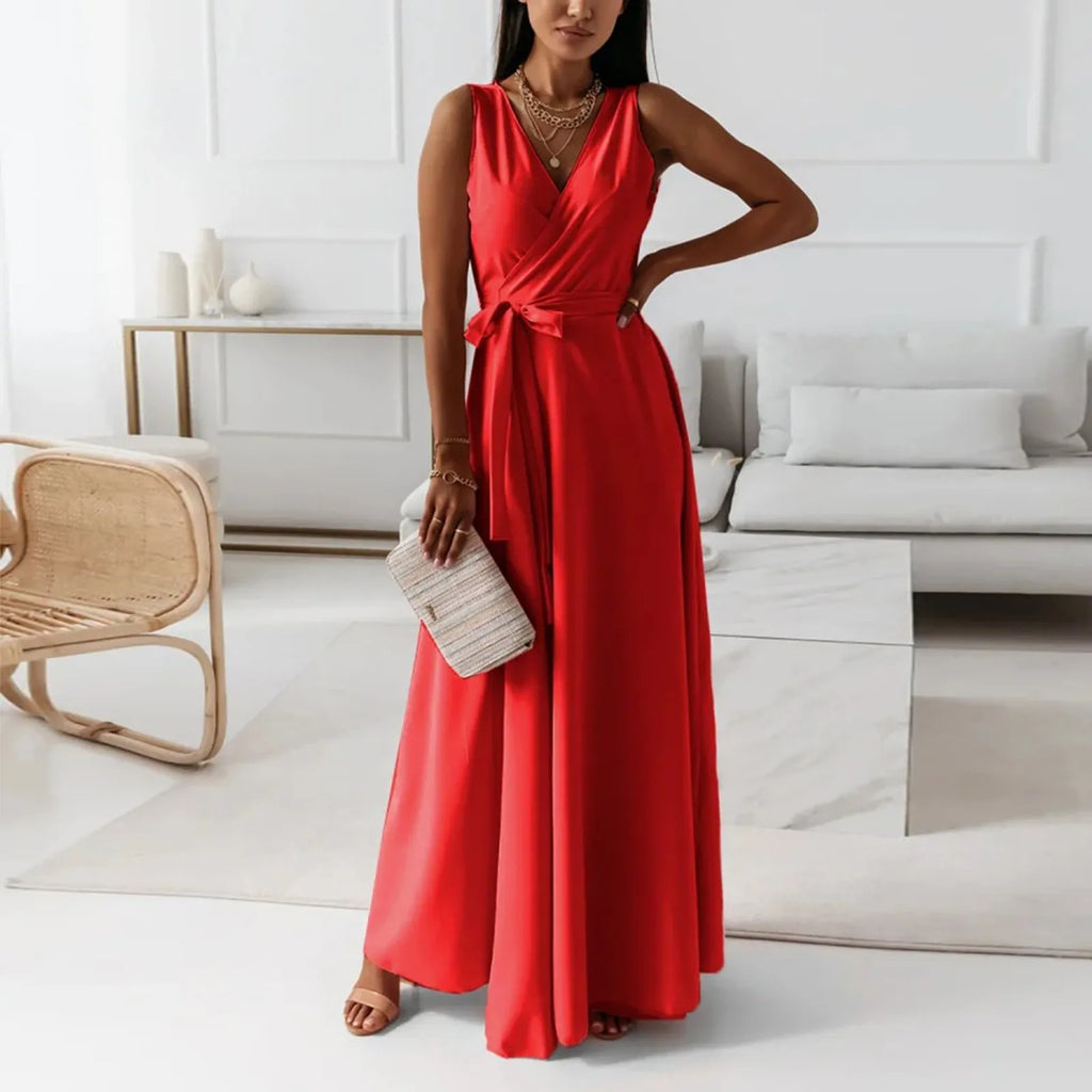 Woman in a red dress standing in a modern living room.