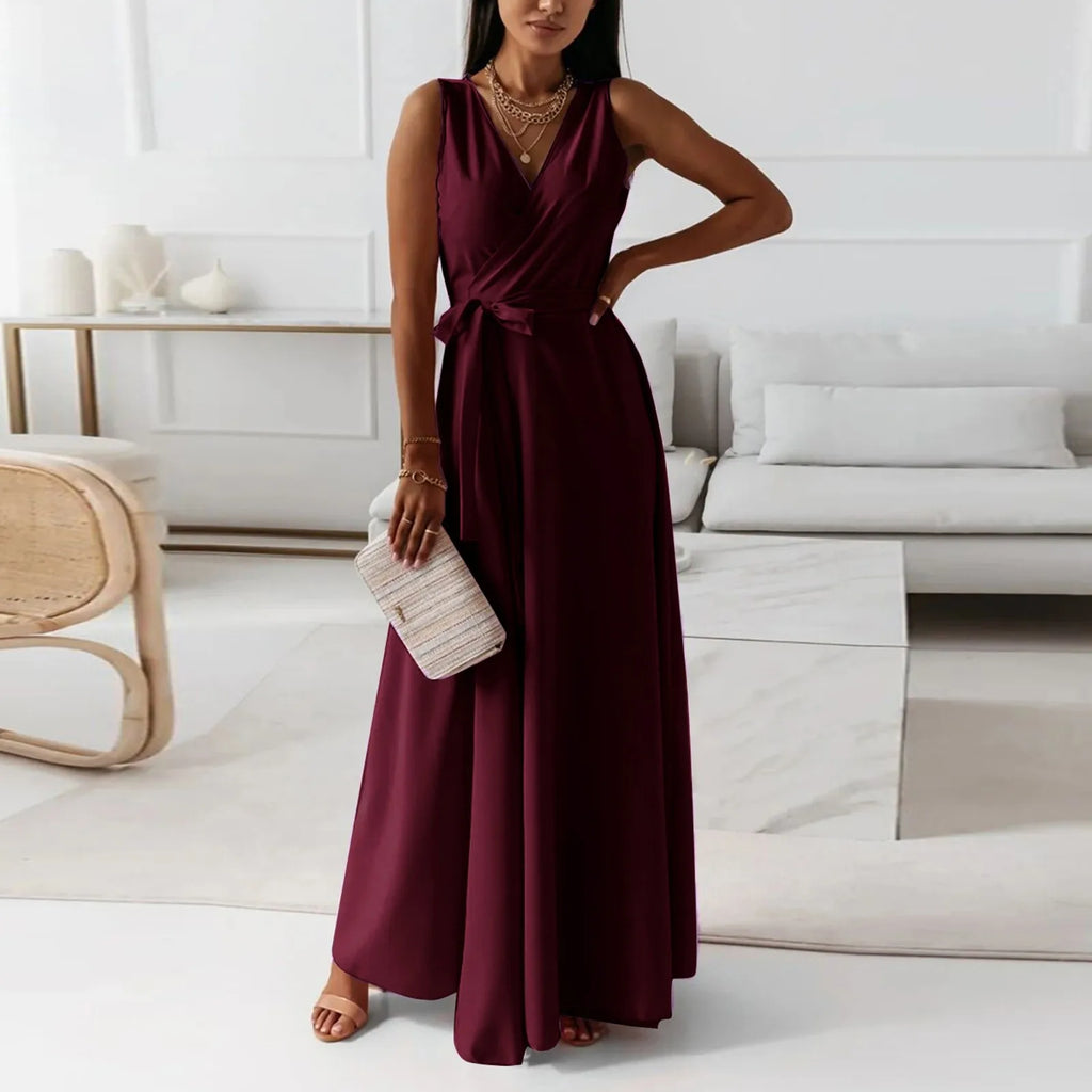 Elegant woman in a burgundy dress standing in a modern living room – The Tottos
